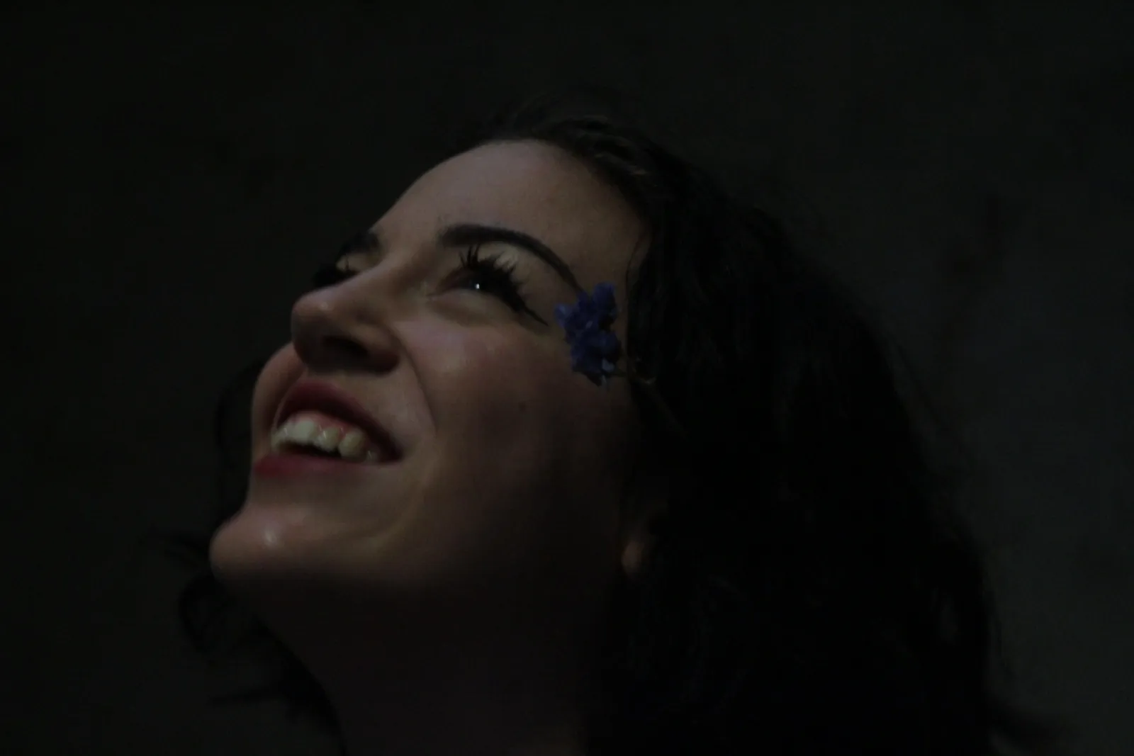 Martha Pardue smiling, looking upward.