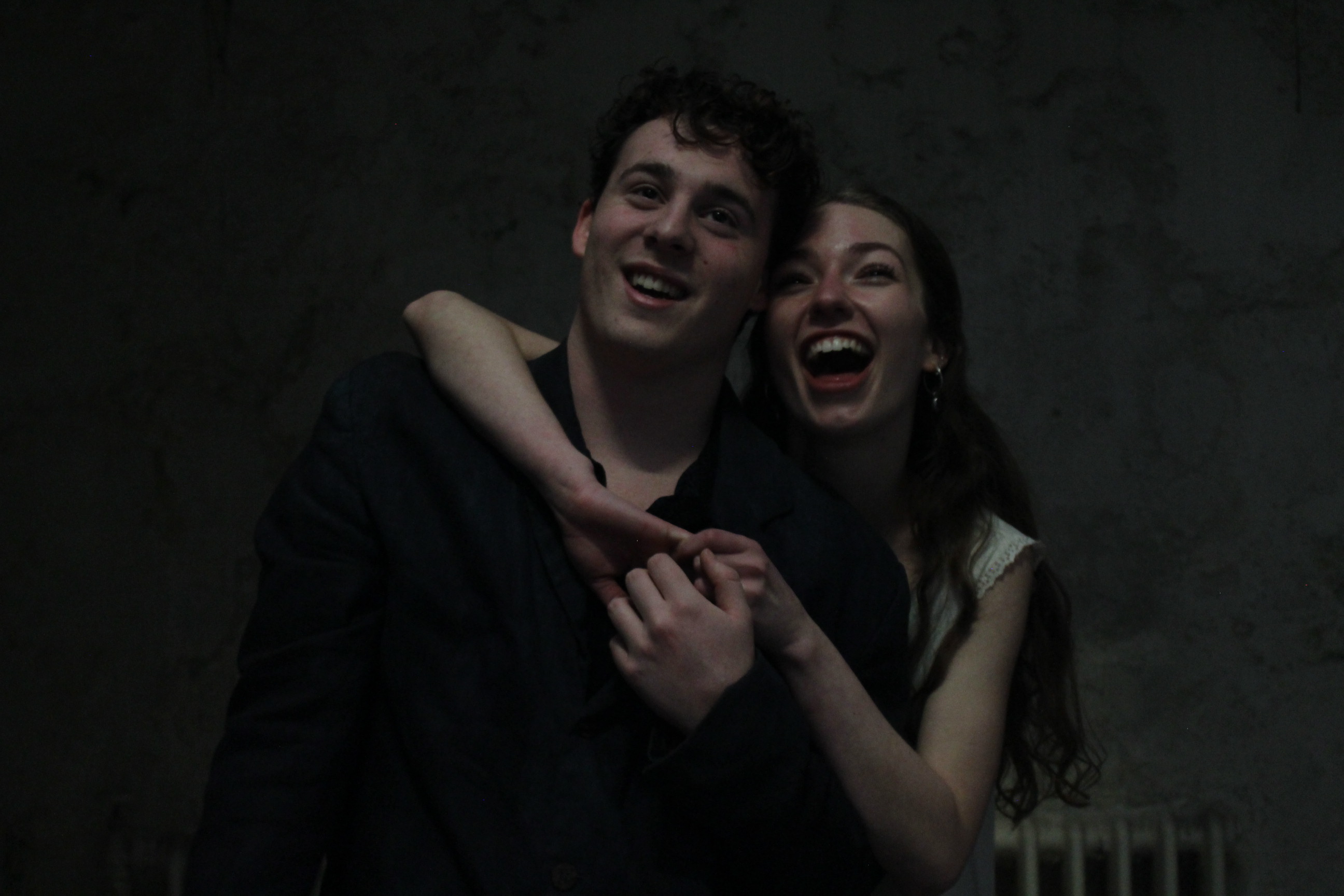 A scene from Eurydice — figures in dialogue on a bare stage.