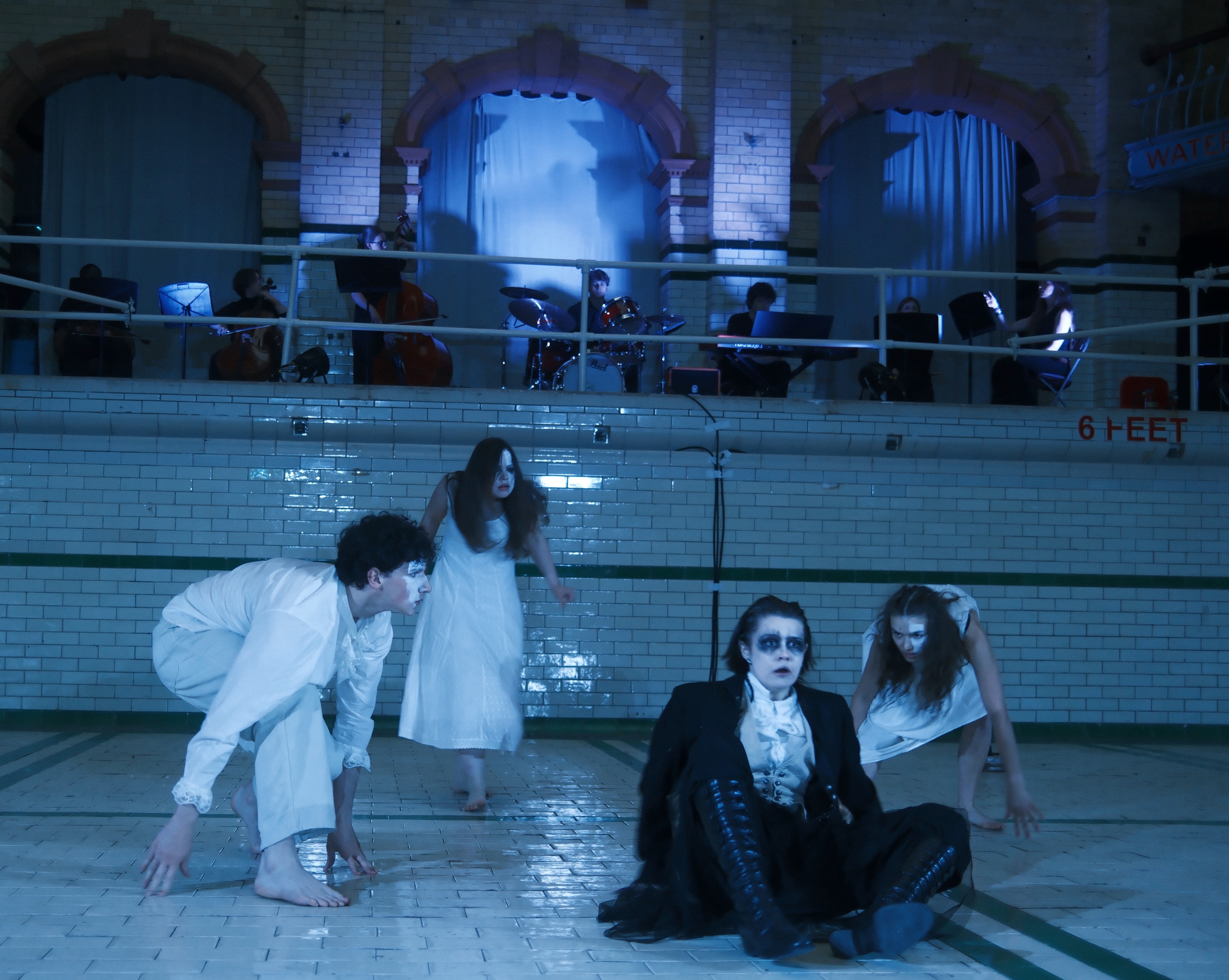 The full ensemble of ghosts crawling on the Victoria Baths tiles under a blue wash.