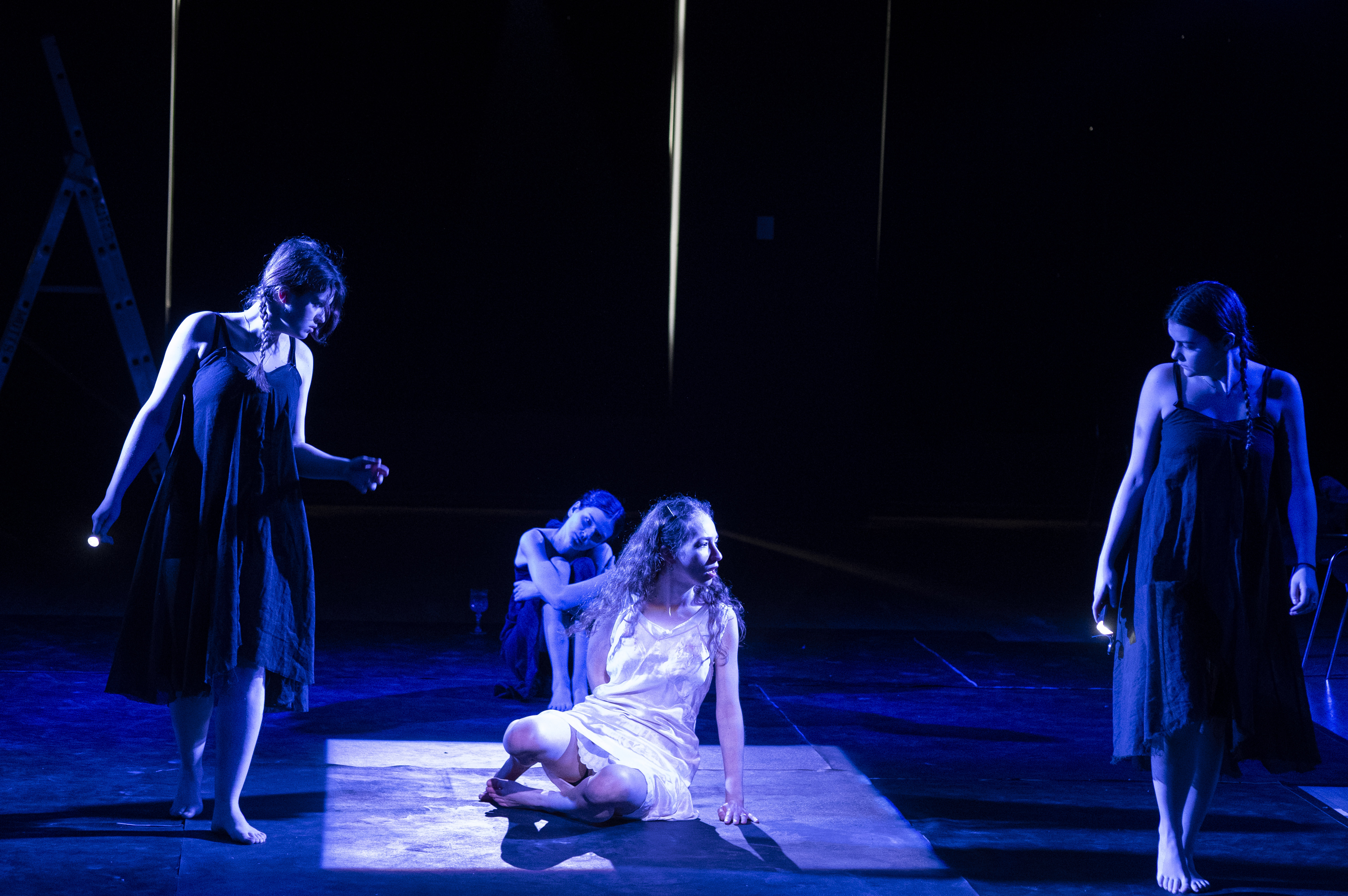 Eurydice and Orpheus caught in a shaft of white light.