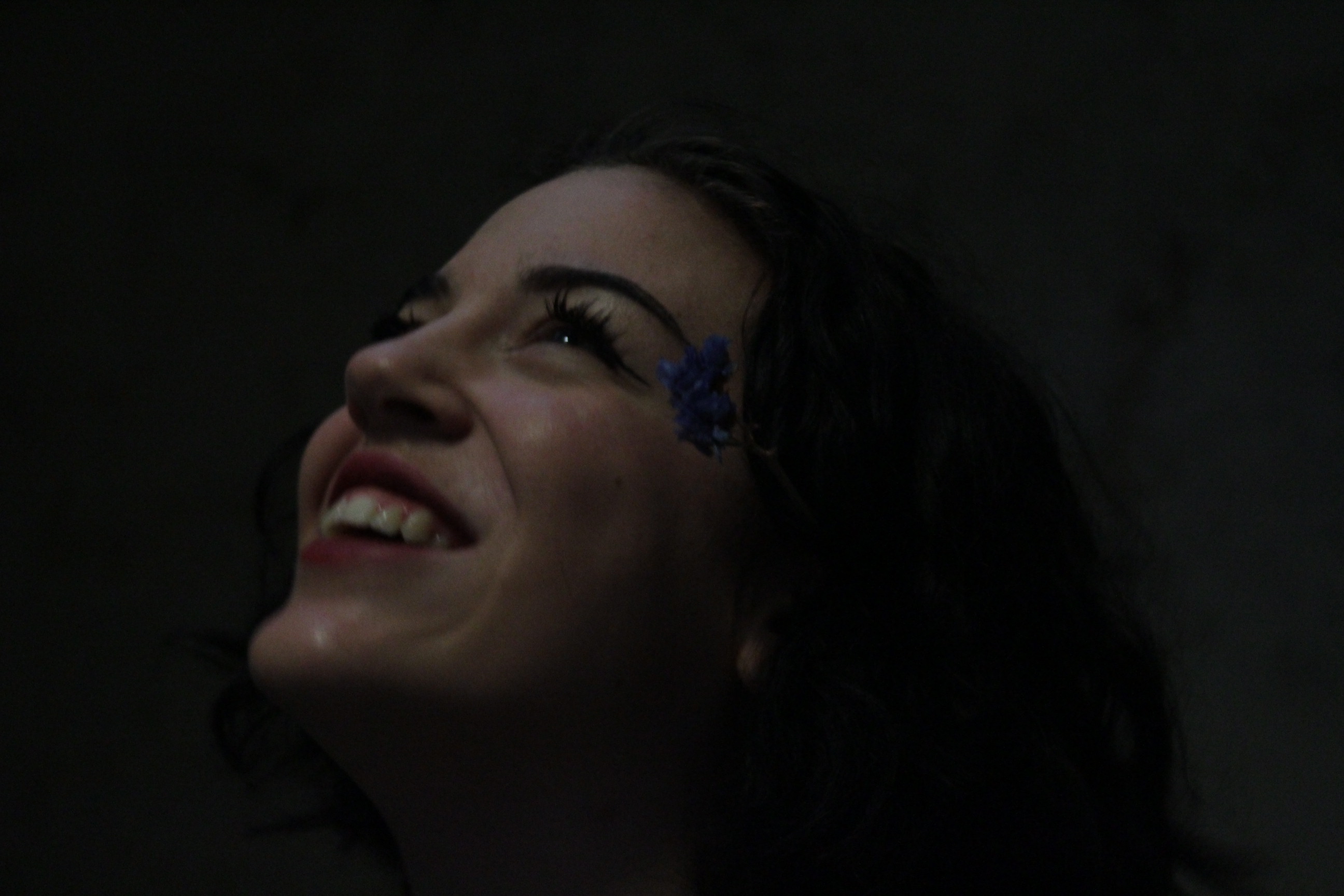 Martha Pardue smiling, looking upward.